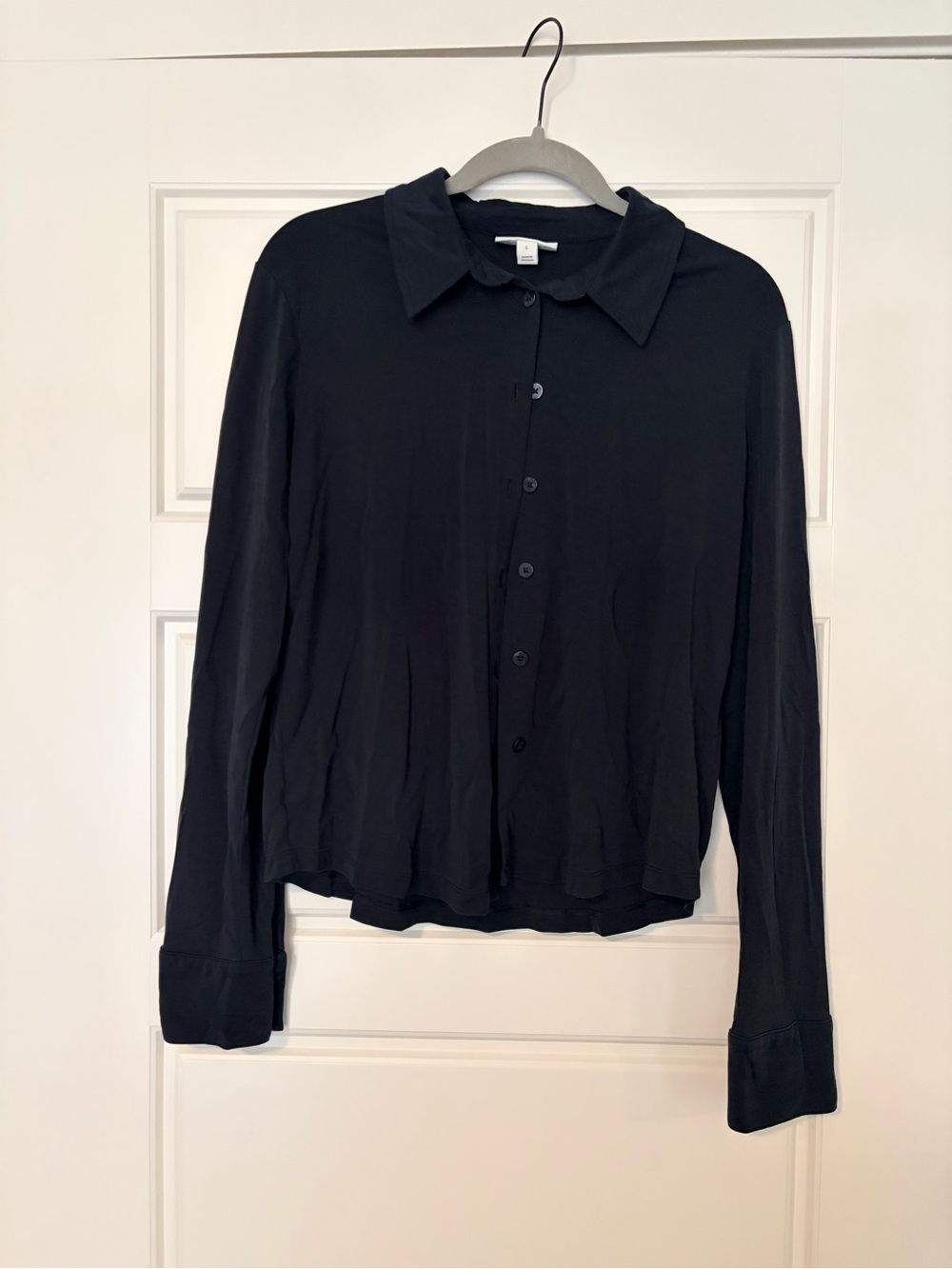 On 34th Black jersey button shirt. Size Large
